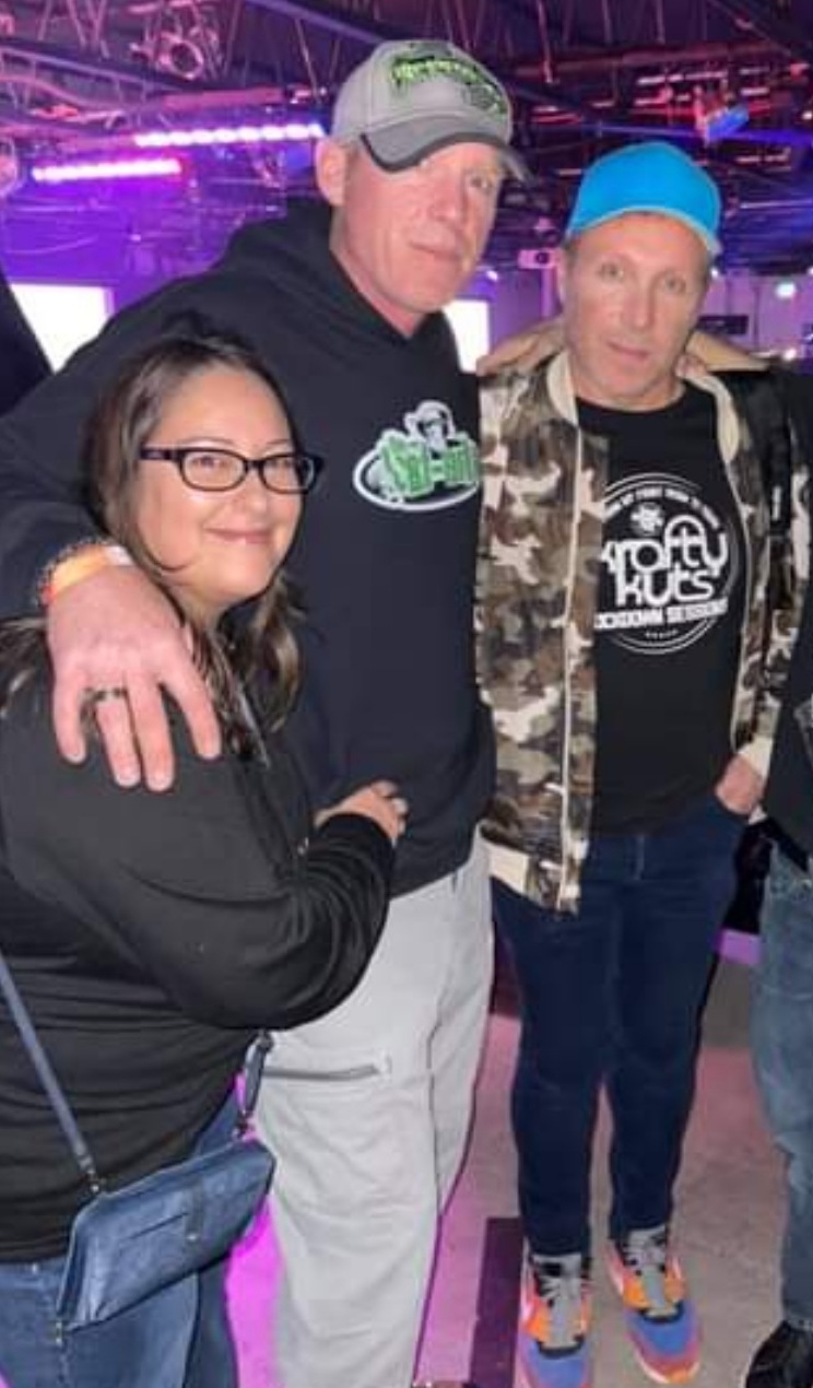 DJ Natural Nate® with two friends at a purple-lit venue, Krofty Kuts Sessions shirt visible